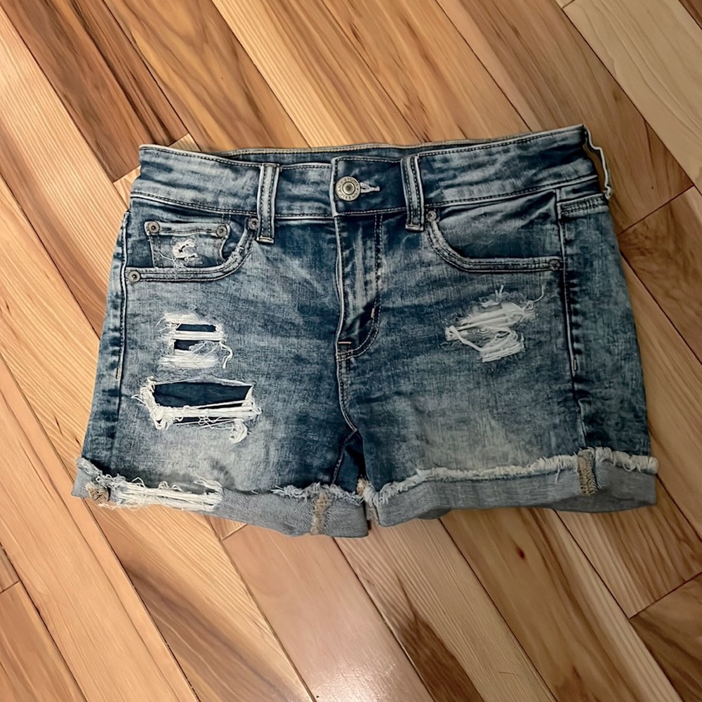 Distressed stretch jean shorts
